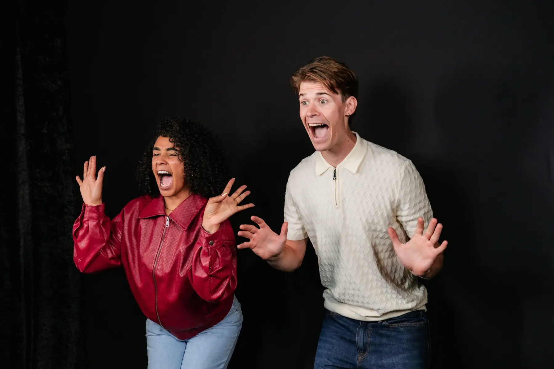 Two guests making surprised expressions during the Doorbell of Doom photo experience
