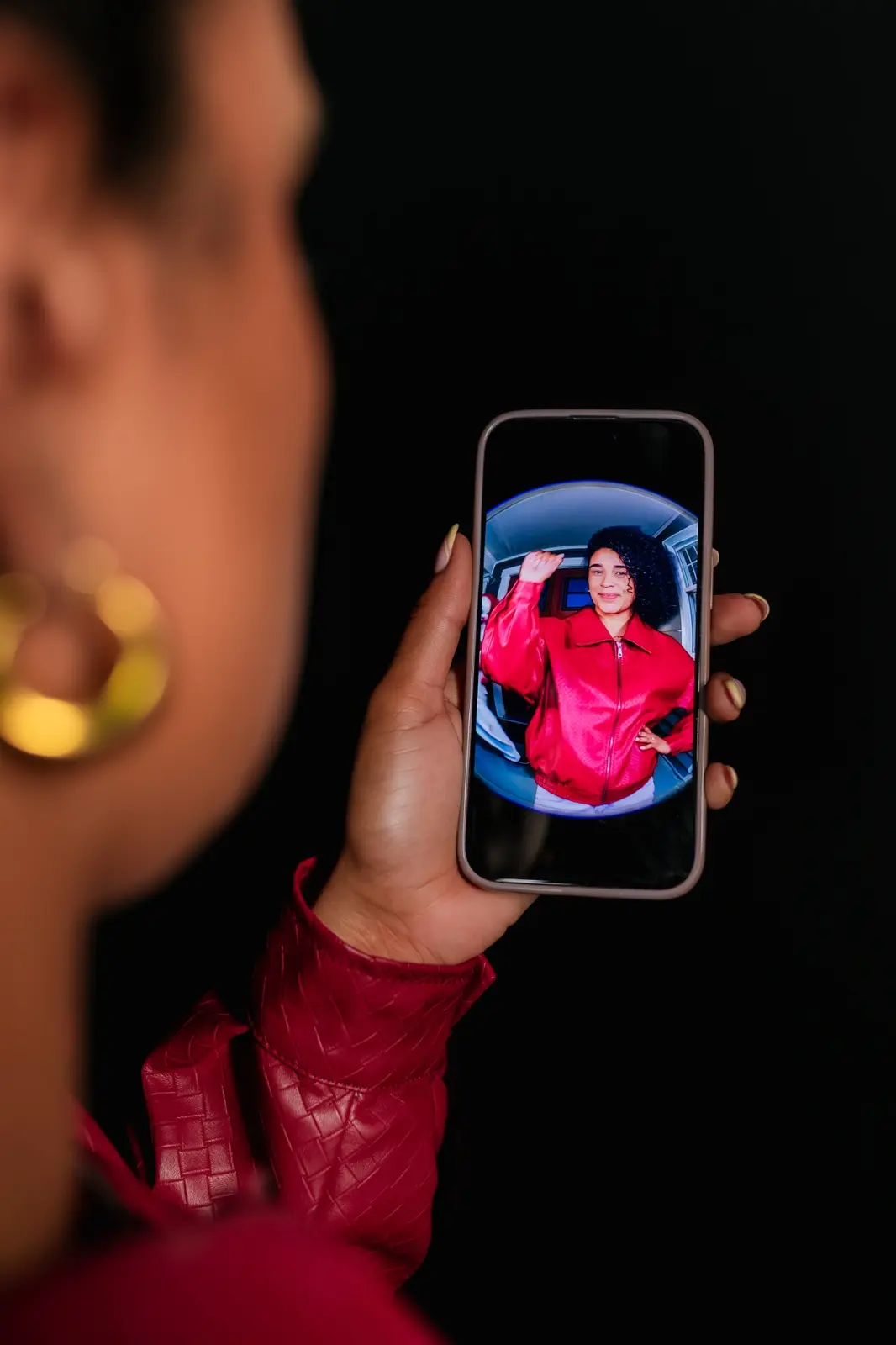 Guest viewing her Doorbell of Doom photo booth image